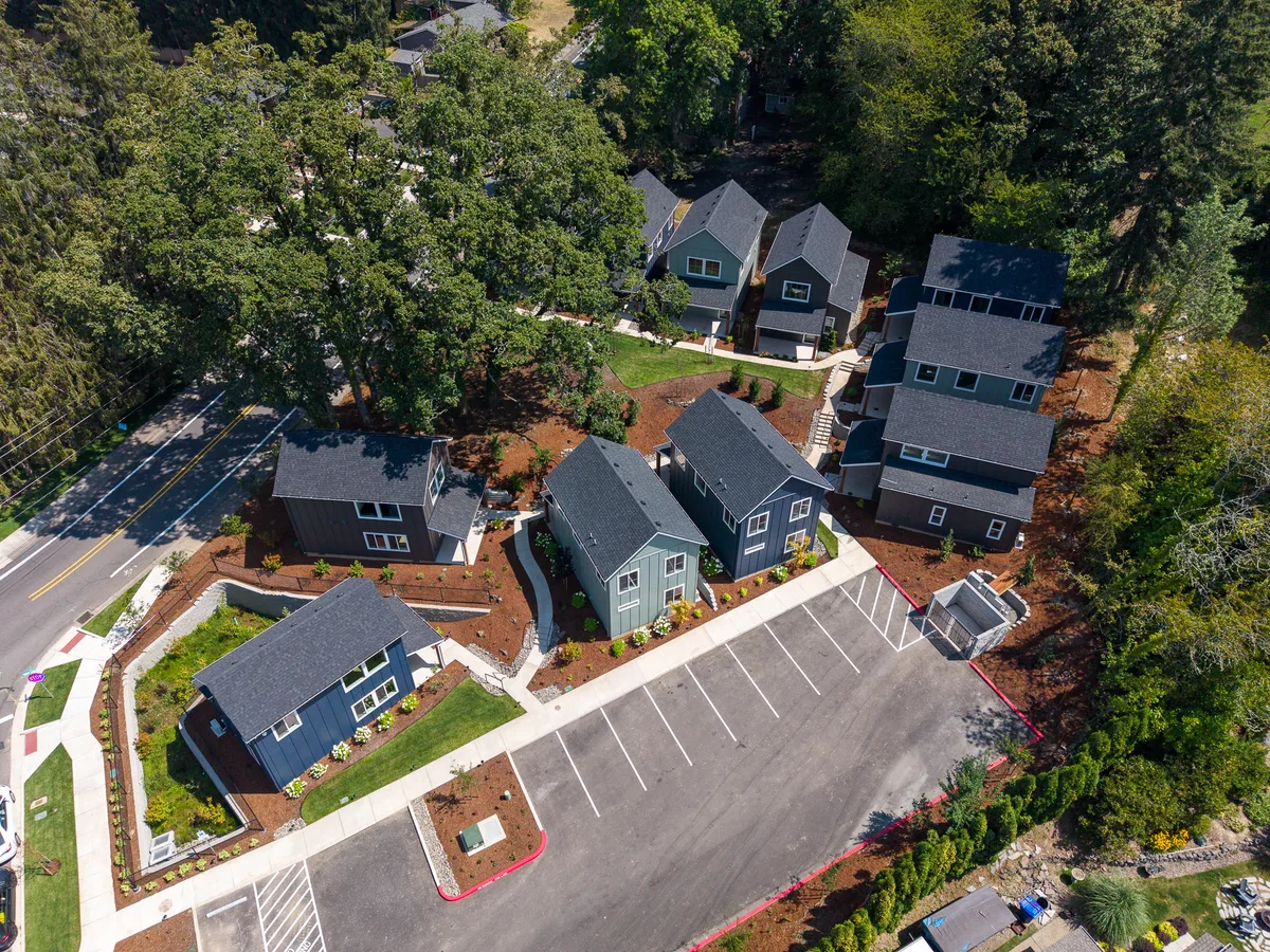 Aerial view of South Haven Cottages showing the homes, shared paths, landscaping, and parking