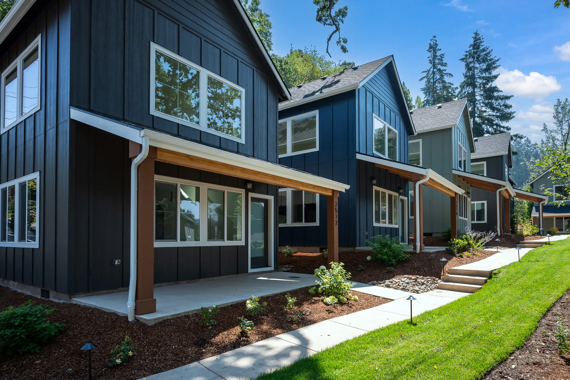 South Haven cottages with covered front porches beside a landscaped walking path